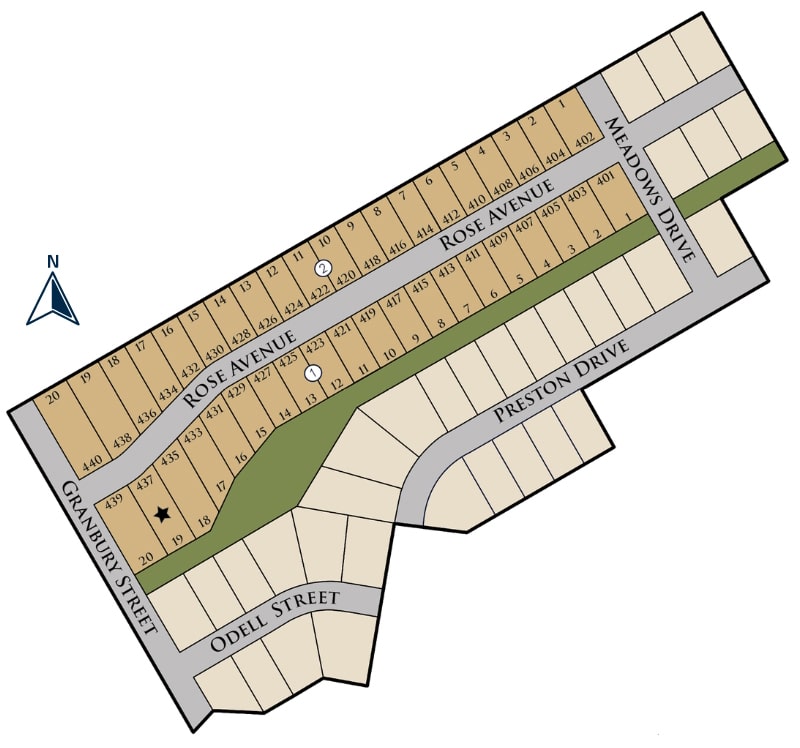 Illustrated map of a residential block showing streets and individual property plots with a compass indicating north.