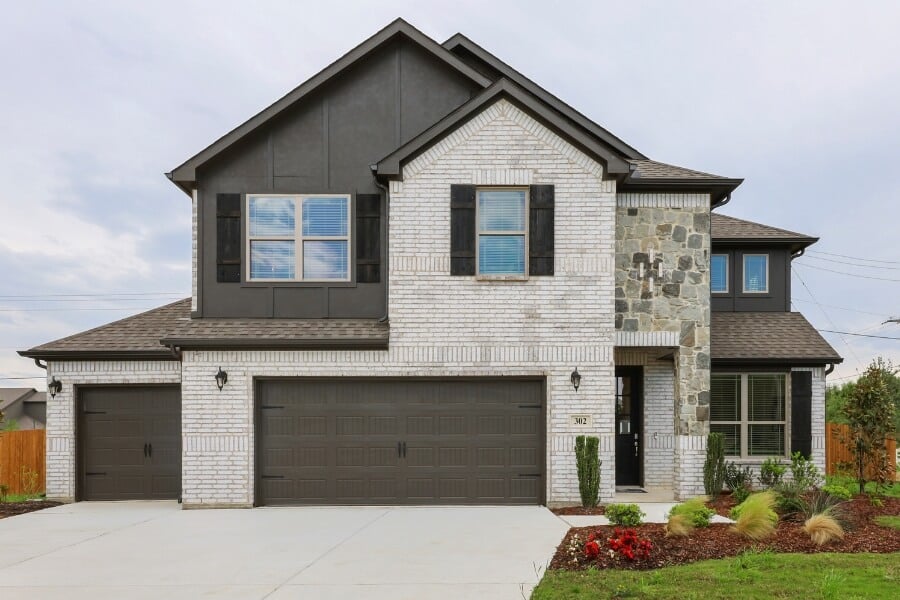 New two-story suburban home with stone accents and double garage.